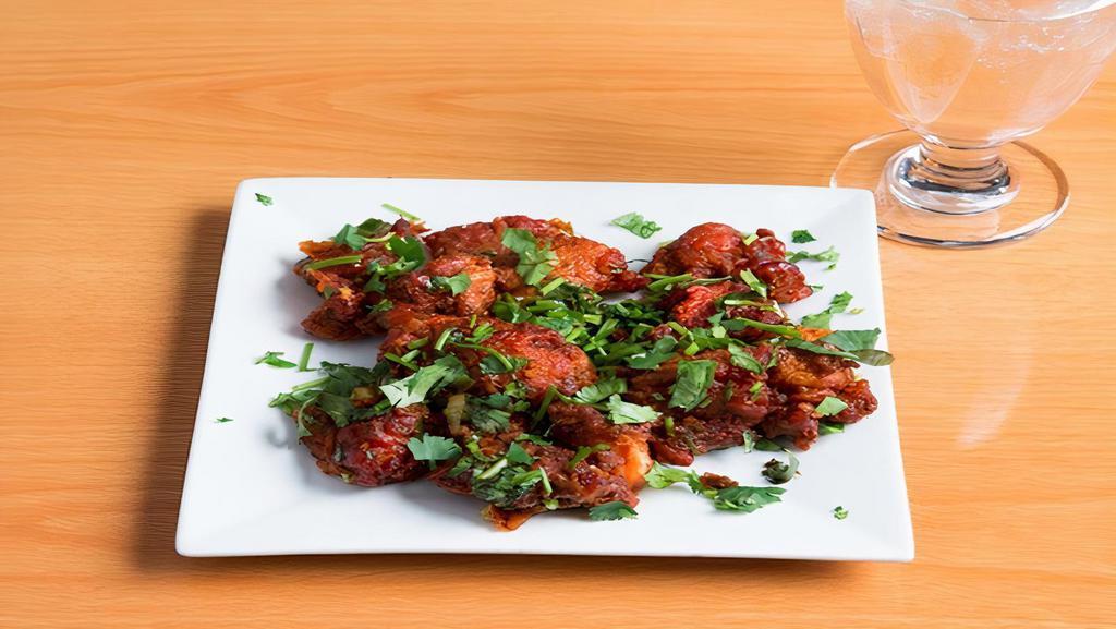 Chicken 65 · Boneless cubes of chicken marinated with indian spices and deep fried.