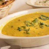 Tadka Dal · Loosened yellow lentil cooked with spices, tomato or spinach, green chilli, cumins and onions.