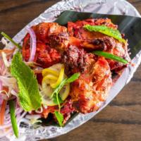 Kodi Tandoori - Chicken Tandoori · Chicken leg and thigh pieces are marinated overnight in yogurt with herbs, spices and cooked...