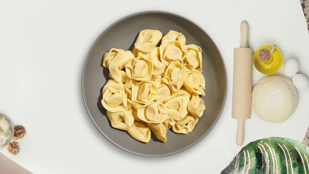A Tortellini Plan · Fresh tortellini served with your choice of sauce and toppings.