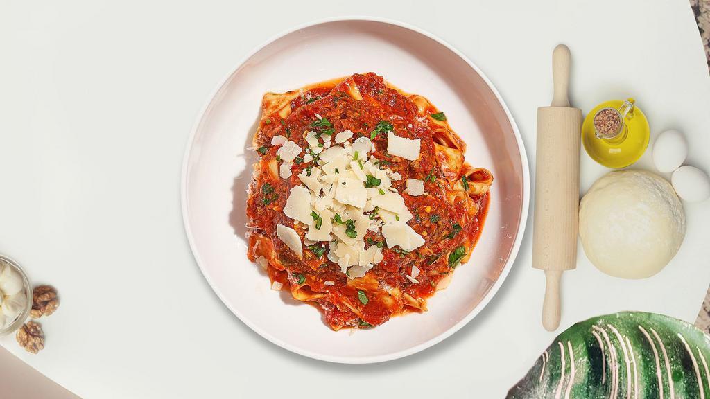 Brag & Beef Pasta · Fresh pasta in tomato sauce with ground beef, mushrooms, olives, and Parmesan cheese.