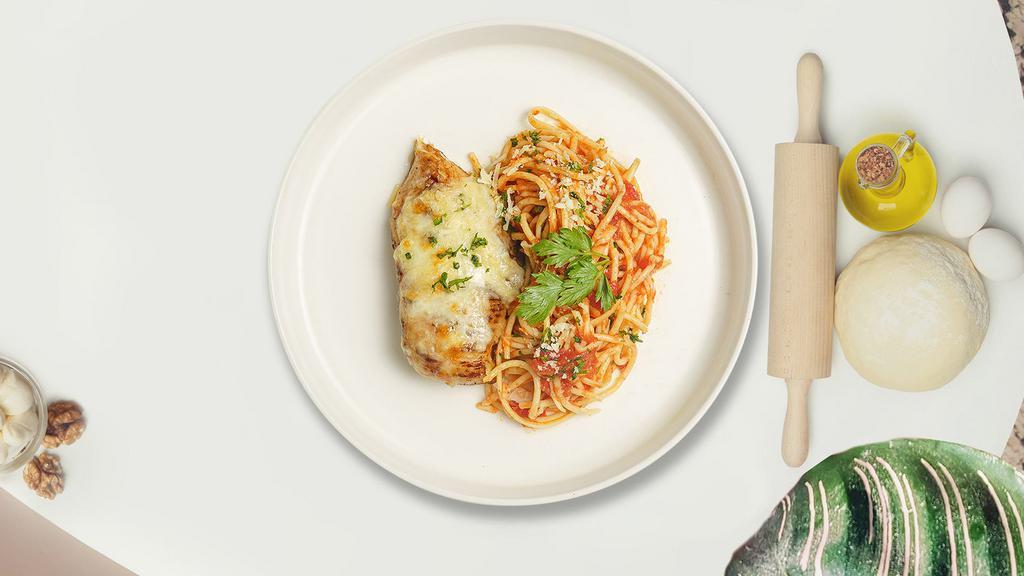 Cheeky Parm Pasta · Fresh pasta in tomato sauce topped with breaded chicken, melted mozzarella cheese, and Parmesan cheese.