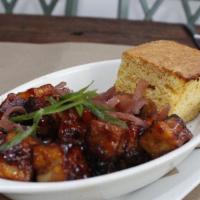 Meat Candy · candied pork belly burnt ends, cornbread, and pickled red onions.