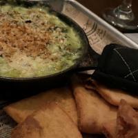 Spinach & Artichoke Dip · served with crispy pita chips