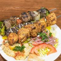 Mixed Grill · 3 kababs, chicken and lamb and ground chicken   , with rice and salad and sauce
