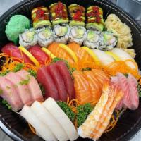Lovers Boat · 6 pcs sushi, 18 pcs sashimi plus dragon roll, and California roll.