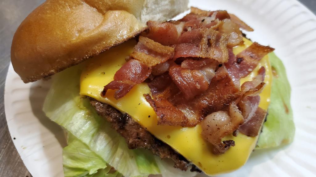 Bacon Cheeseburger · A single Cheeseburger (1/5 lb) with Lettuce, Tomato and Mayo, topped with bacon, .  Served on an Artisan Roll.