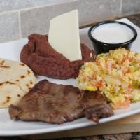 Desayuno Centroamericano · Scrambled Eggs, Beans, Cream, Steak, Cheese, Tortilla & 2 Sweet Plantain