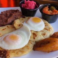 Desayuno Salvadoreño · 2 Fried Eggs, Refried Beans, 2 Cheese Pupusas, Sweet Plantains.