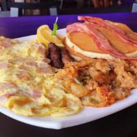 Ham & Cheese Breakfast Omelette · Ham & Cheese Omelette with bacon strips, sausage, and 2 buttermilk pancakes.
