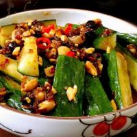 Smashed Cucumber Salad · Topped with roasted peanuts, cilantro, sesame seed, garlic, soy-vinaigrette, and house-made ...