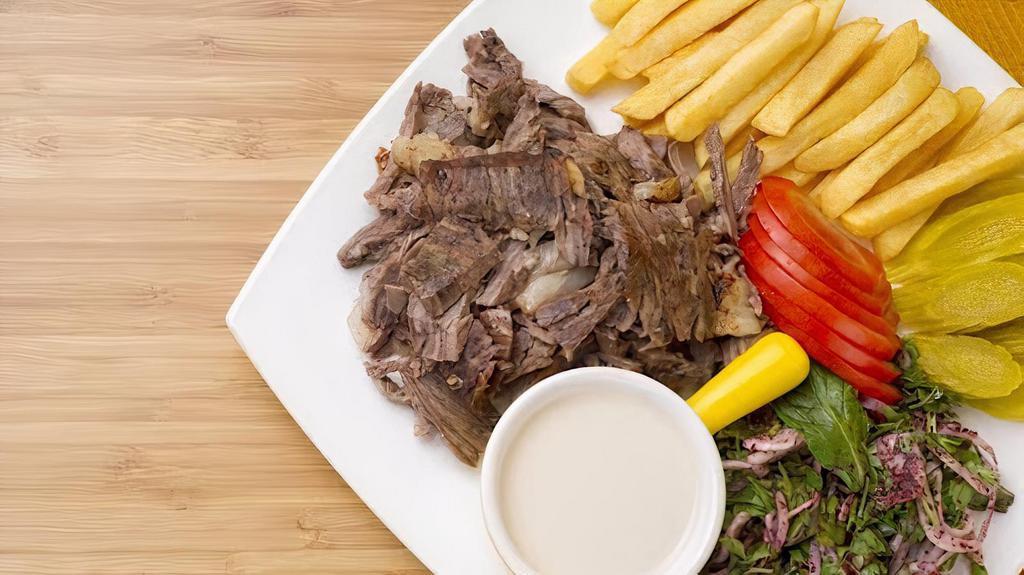 Beef Shawarma Meal · Served with rice or fries, white sauce, home salad, soup, hummus, and bread.