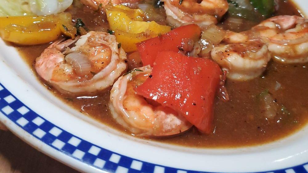 Garlic Shrimp · Jumbo shrimp tossed in olive oil, freshly chopped, and rainbow of bell peppers. Served with rice and peas or jasmine rice, steam vegetable, or salad.