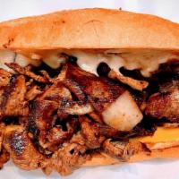 Y.C. Cheesesteak · 8 oz. shaved Premium Ribeye, grilled onion, American and  Cheddar cheese, and hot sauce, on ...