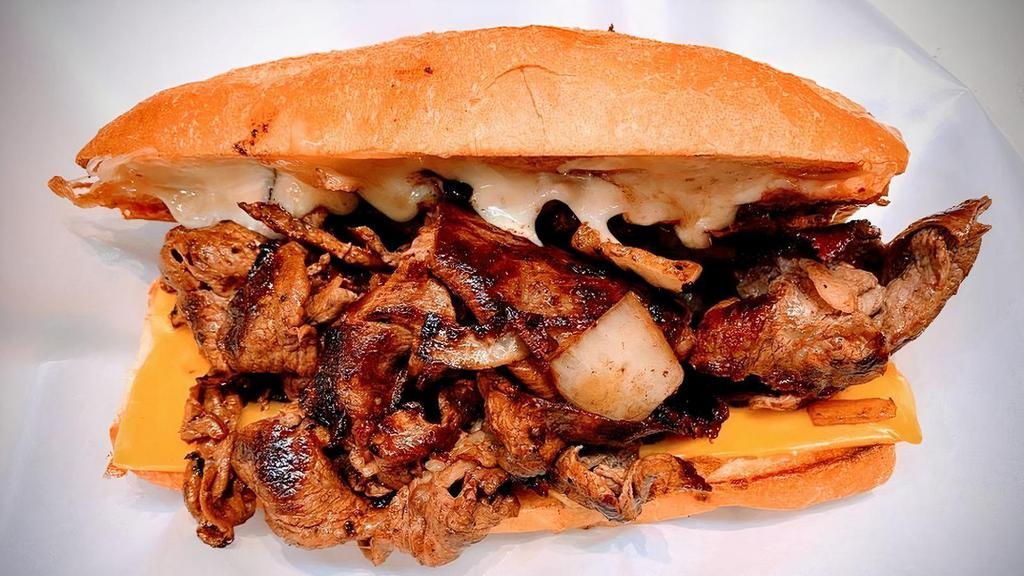 Y.C. Cheesesteak · 8 oz. shaved Premium Ribeye, grilled onion, American and  Cheddar cheese, and hot sauce, on a hero.