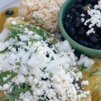Black Bean & Spinach Enchiladas · Three white corn tortillas topped with our house made tomatillo salsa, onions, cilantro, que...