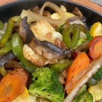 Farmers Market Fajitas · Grilled portabella mushrooms, zucchini, carrots, peppers and onions. Served with black beans...