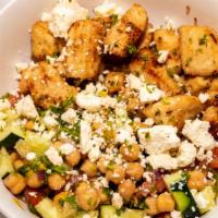 Greek Chicken Bowl · Chicken souvlaki, chickpeas, cucumber tomato salad, quinoa, yogurt dressing, feta.