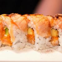 Dancing Monkey Roll · Spicy salmon, mango and blow torched yellowtail.