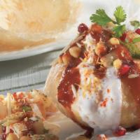Raj Kachori · A big fried crispy sphere shape ball, stuffed with potato and sprout, served with curd, hone...