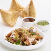 Samosa Chat · The tangy starter made from a vegetable samosa cut into pieces and mixed with chopped onion,...