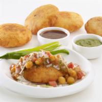 Aloo Tikki Chaat · Crisp and browned spiced potato patties served with spicy North Indian chickpea.