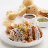 Bhalla Papri · Deep fried lentil fluffy balls, garnished with dahi (curd), papdi, honey chilly paste (chutn...