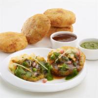 Aloo Tikki · Crisp and browned spiced potato patties served with spicy North Indian chickpea.