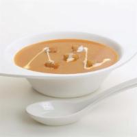 Cream Of Tomato Soup · It is smooth delicious texture soup of tomato, garnished with fresh green corriendar, topped...