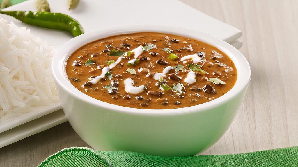 Dal Makhni · The harmonious blend of black lentil (urad), red kidney beans (rajma) tomatoes, ginger finished with cream and served with a dollop of unsalted butter. Come with Rice