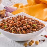 Chana Masala · A traditional Indian spiced chickpeas curry favored with a blend of onions, tomatoes, ginger...