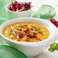 Dal Tadka · Comfort food-boiled yellow lentil spiced up with Indian herbs. Come with Rice