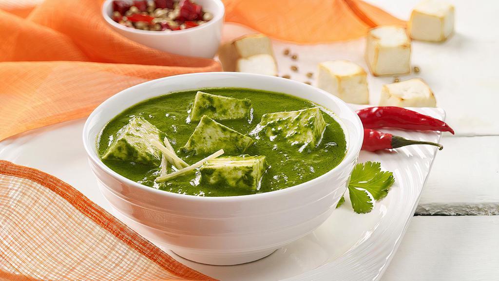 Palak Paneer · Cottage cheese cooked in a thick paste of spinach and seasoned with garam masala, and other spices.