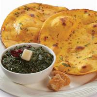 Sarso Ka Saag · Pureed tender mustard leaves cooked with Indian spices. Come with Rice