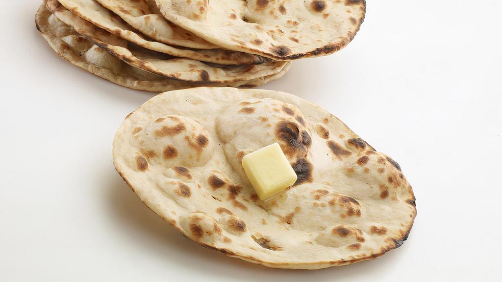 Tandoori Butter Roti · A light, flat, unleavened crispy bread cooked in oven (tandoor).