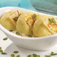Rasmalai (2 Pcs.) · Delicate round shape Cottage cheese patties soaked in thick milk flavored with cardamom and ...
