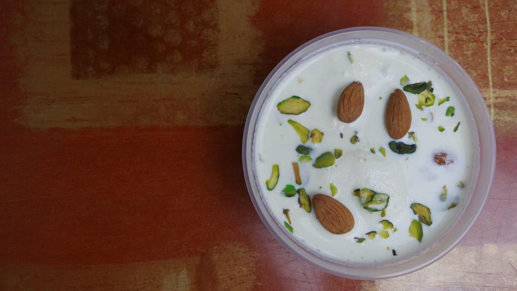 Rasmalai · Homemade cheese simmered with milk and nuts, served cold.