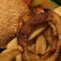Cheeseburger Deluxe · Charcoal broiled 1/2 lb. burger. Served with creamy coleslaw, pickles, French fries, onion r...