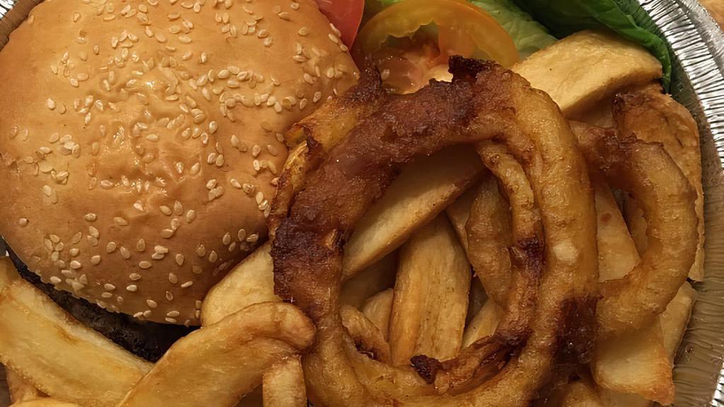 Cheeseburger Deluxe · Charcoal broiled 1/2 lb. burger. Served with creamy coleslaw, pickles, French fries, onion rings, lettuce and tomato.