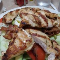 Cobb Salad · Sliced chicken, avocados, hard boiled egg, tomato, bacon and bleu cheese over mixed greens. ...