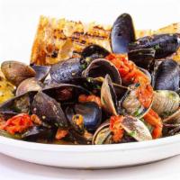 Clams & Mussels All'Italiana · Clams and mussels served in a light marinara sauce topped with fresh tomatoes, parsley and r...