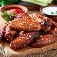 Teriyaki Chicken Wings - Bone-In · Delicious bone-in chicken wings fried and tossed in Teriyaki sauce, and cooked to a perfect ...