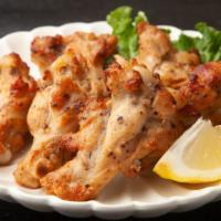 Lemon Pepper Wings - Bone-In · Delicious bone-in chicken wings fried and tossed in Lemon Pepper sauce, and cooked to a perf...