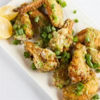 Garlic Parmesan Wings - Bone-In · Delicious bone-in chicken wings fried and tossed in Garlic Parmesan sauce, and cooked to a p...