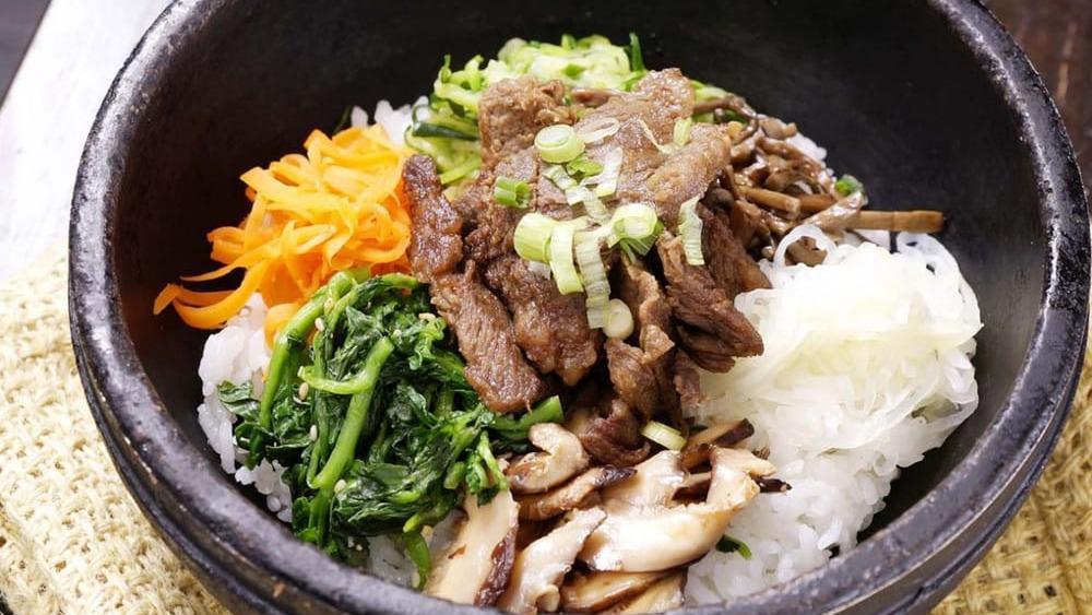 Galbi Dolsot · marinated beef short ribs (boneless) mixed together with rice and assorted vegetables. *does NOT come with an egg, it is extra. *when dining in it is served in a hot stone pot