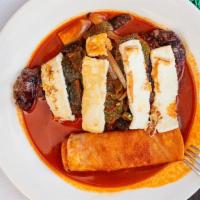 Steak A La Tampiqueña · NY steak topped with sauteed chile ancho, onions,and poblano peppers sauce,queso fresco serv...