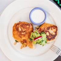 Chimichanga · Flour tortilla stuffed With meat or choice, peppers, onions and cheese, guacamole on the side.