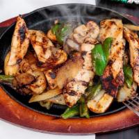 Chicken Fajitas · Grilled chicken with sauteed onions, peppers, mushrooms and spices.