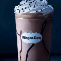 Belgian Chocolate Milkshake · Belgian chocolate ice cream blended and surrounded by ribbons of hot fudge topped with whipp...