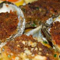 Vongole Al Forno · Baked clams with seasoned bread crumbs, garlic, lemon and herb.